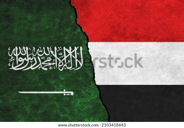 Saudi Arabia and Yemen painted flags on a wall\
with a crack. Saudi Arabia and Yemen conflict. Yemen and Saudi\
Arabia flags\
together
