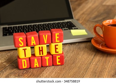 Save The Date On A Wood Cube In A Corporate Background