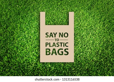 Say no to plastic bags. Paper cut of Eco concept on green grass background.  - Powered by Shutterstock