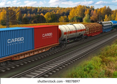 Scenic View Of Mixed Freight Train Within Rural Landscape