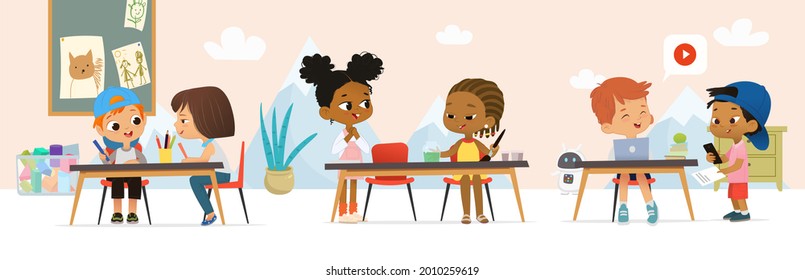 School Class. Multicultural children in play the playroom, Drawing activity in the art class. Boy and Girl draw pictures with paints and pencils, painting with watercolor, learning code and talking. - Powered by Shutterstock