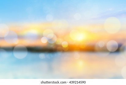Sea shore sunset blurred view background.Vocation concept backdrop.Horizon coast defocused illustration.