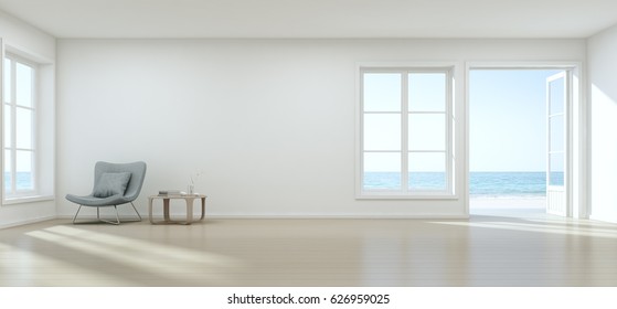 Sea view living room with empty wall in modern beach house, Luxury white interior of summer home - 3D rendering