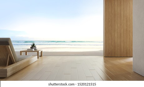 Sea View Terrace And Bed In Modern Luxury Beach House With Blue Sky Background. Lounge Chair On Wooden Deck At Vacation Home Or Hotel. 3d Rendering Of Tourist Resort.