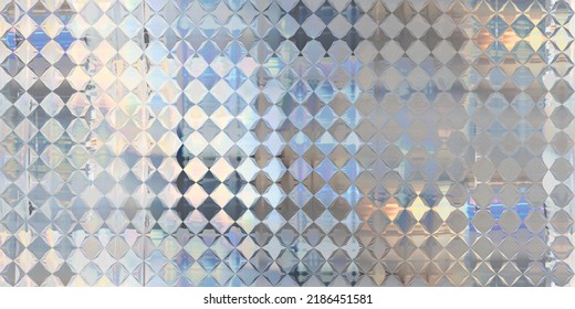 Seamless Holographic Iridescent Silver Diamond Birthday Background Texture. Trendy Reflective Cyberpunk Metallic Mirror Foil Pattern With Rainbow Prism Light Effect. Retro 80s Vaporwave 3D Rendering
