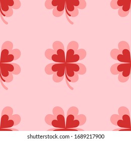 Seamless pattern of four large isolated red clover symbols. The elements are evenly spaced. Illustration on light red background