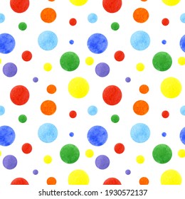 Seamless pattern. Painted with watercolors. Colorful polka dots: red, yellow, blue, green, purple. For packaging paper or fabric.