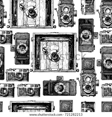 Seamless pattern with photo cameras.