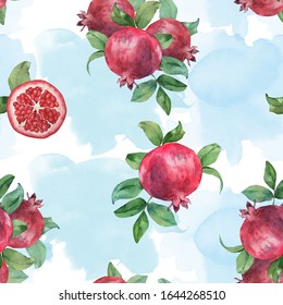Seamless pattern of pomegranate fruit on a watercolor background. Watercolor painting
