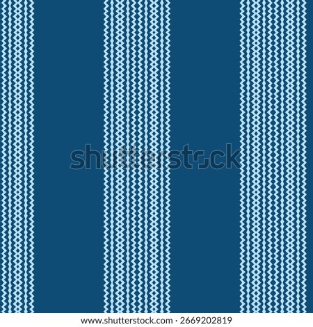 Seamless pattern of vertical stripes featuring a fine geometric zig-zag or chevron texture. A simple, classic blue background inspired by ethnic weaving and ikat textiles