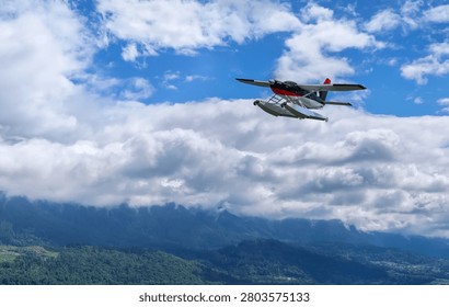 Seaplane soaring above dramatic clouds and mountain ridges over British Columbia, evoking travel and adventure; 3d Rendering, Background in BC, Canada