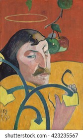Self-Portrait, by Paul Gauguin, 1889, French Post-Impressionist painting, oil on wood panel. Gauguin's disembodied head and one hand floats with symbols of good and evil, and heaven and hell. He buil