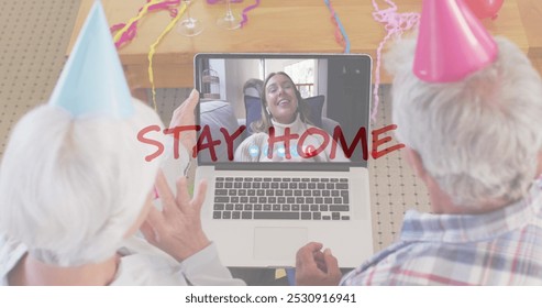 Senior couple celebrates with a teenage girl on a video call. Party hats and decorations suggest a virtual birthday party during a stay-at-home order. - Powered by Shutterstock