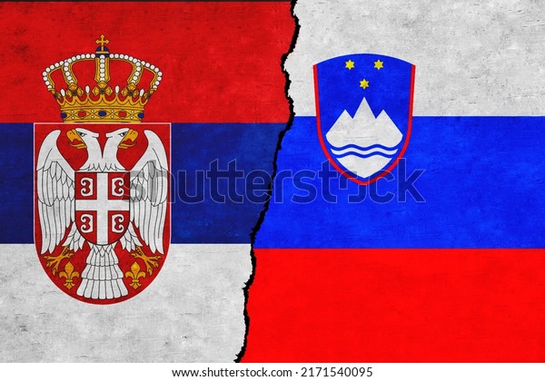 Serbia and Slovenia painted flags on a wall with\
a crack. Slovenia and Serbia relations. Serbia and Slovenia flags\
together