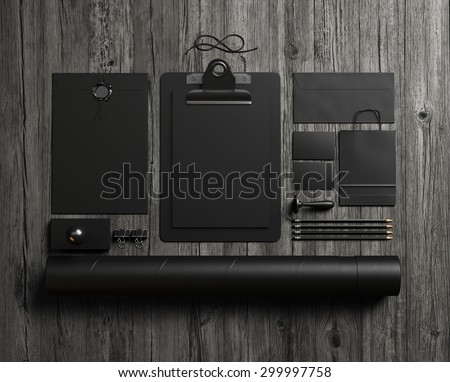 Set of black mockup elements on the wood table. 3d render