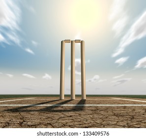 A set of cricket wickets set up on a cracked cricket pitch with white markings on a blue sky background