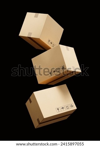 Set of falling beige cardboard boxes for delivery of goods isolated on a black background. Recyclable packaging. Mockup. 3d render