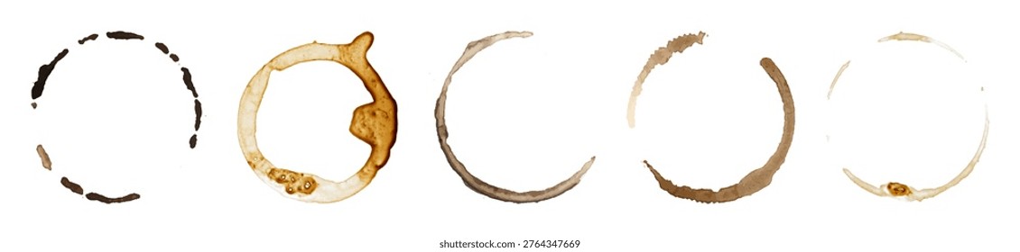 Set of five coffee cup ring stains in varying shades of brown, isolated on a white background, showcasing different spill patterns.