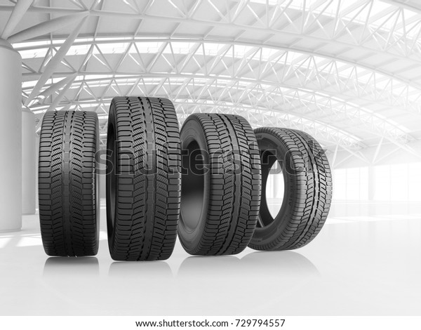 Set\
of four car tires at big warehouse. 3d\
illustration.