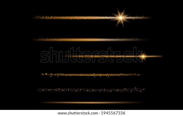 Set of gold glittering star dust trail\
sparkling on black background. Magic fairy\
dust.