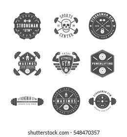 Set of gym logos, labels and slogans in vintage style. Graphic illustration

