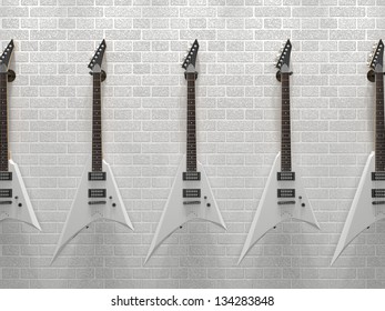 Several Guitars Hanging On A Brick Wall