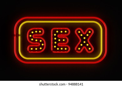 Sex Neon Sign Illuminated Over Dark Background