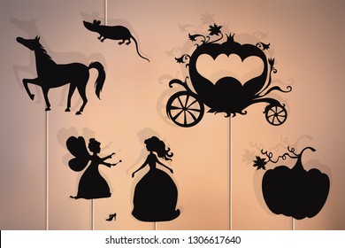 Shadow puppets of Cinderella, fairy godmother, glass slipper, pumpkin, mouse, enchanted carriage and horse.