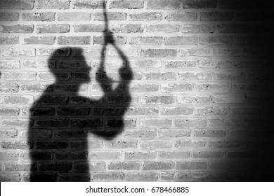 Shadow of sad man hanging suicide. light and shadow