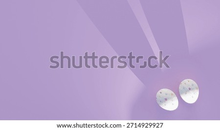 Shadows and painted eggs suggest Easter bunny