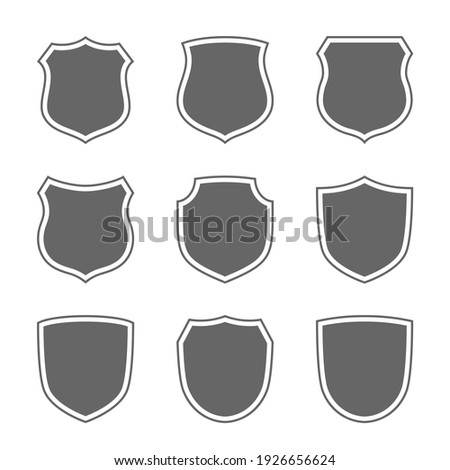 Shield shape icons set. Gray label signs isolated on white. Symbol of protection, arms, coat honor, security, safety. Flat retro style design. Element vintage heraldic emblem illustration