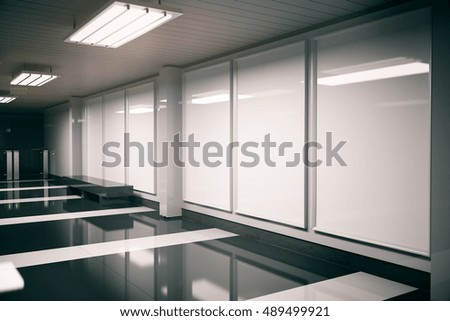 Shiny dark interior with empty white advertisement posters and ceiling lamp. Side view, Mock up, 3D Rendering