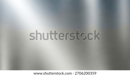 A shiny, metallic surface with a gradient of light and shadow, creating a sense of depth and texture. The image appears to be a close-up of a reflective material.