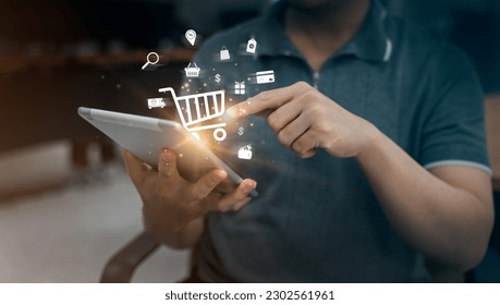 Shoppers use tablets to input orders with credit card delivery for online shopping and e-commerce technology concepts.