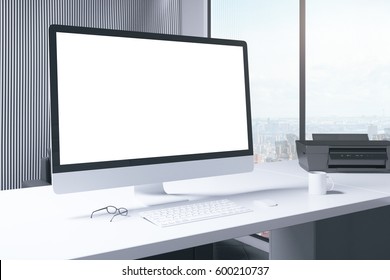 Side View Of Blank White Pc Screen Placed On Desktop With Coffee Cup And Other Items. Office With City View. Mock Up, 3D Rendering