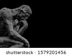 Side view bronze thinker sculpture background template in dark grey and black background color