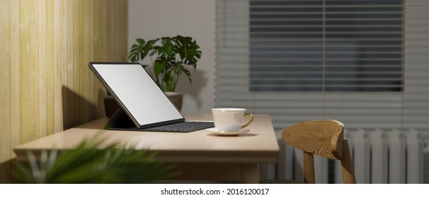 Side View, Cozy Home Office Interior In Living Room, Digital Tablet With Keyboard And Coffee Cup On Wood Table, Overhead Light, Work At Night, 3d Rendering, 3d Illustration