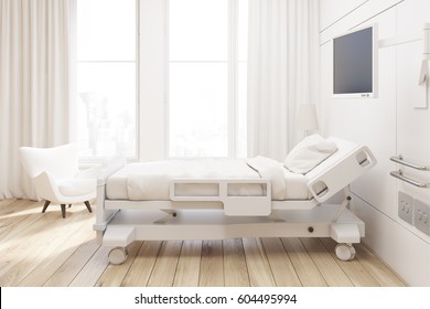Side view of a hospital ward with a bed, a tv set, a white armchair and curtains on large windows. 3d rendering, Mock up