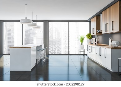 Side view of panoramic kitchen area with wooden and white cabinets. Table with blue bar stools. Flower stand at the window behind. Grey tiling floor. 3d rendering