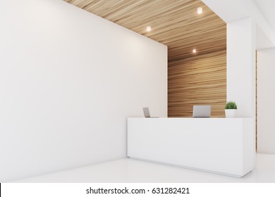 Side view of a reception desk standing in an office with light wooden wall elements. 3d rendering, mock up