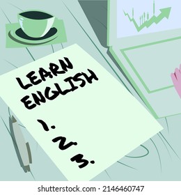 Sign Displaying Learn English. Business Showcase Universal Language Easy Communication And Understand Laptop Resting Beside Coffee Mug And Plain Sheet Showing Work Process.