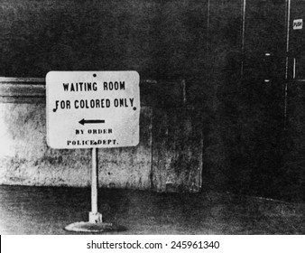 Sign reading 'waiting room for colored only, by order Police Dept.' Ca. 1940s or 1950s.