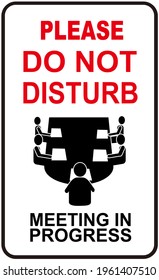 A Sign That Says : PLEASE DO NOT DISTURB. MEETING IN PROGRESS.