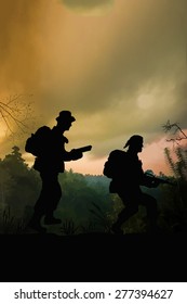 Silhouette Of American Special Forces Soldiers On Patrol In The Jungle Of Vietnam. (Artist Illustration)