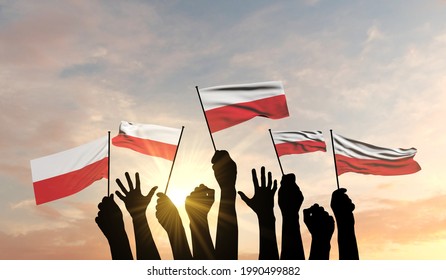Silhouette of arms raised waving a Poland flag with pride. 3D Rendering - Shutterstock ID 1990499882