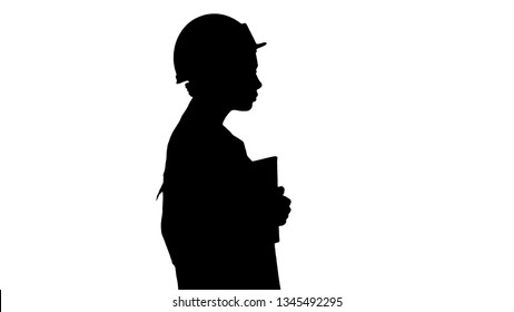 Silhouette Attractive Hispanic Woman In White Lab Coat And White Safety Hard Hat Walking Holding Notebook Or Tablet.