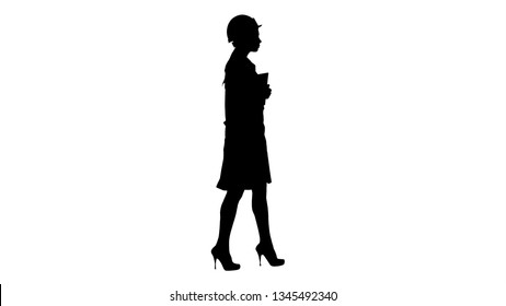 Silhouette Attractive Hispanic woman in white lab coat and white safety hard hat walking holding notebook or tablet. - Powered by Shutterstock