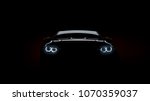 silhouette of black sports car with headlights on black background, photorealistic 3d render, generic design, non-branded