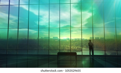 Silhouette Of A Businessman Against The Huge Office Window