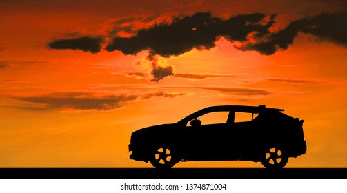 Silhouette Car On Sunset Background.